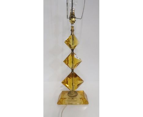 A amber glass table light Condition report: 48cm high, good condition, brass togs seperating the glass pieces are worn