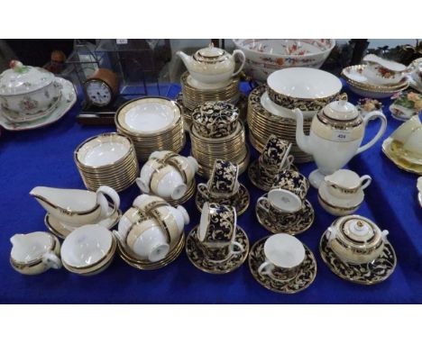 An extensive Wedgwood Cornucopia pattern tea, dinner and coffee service comprising cups and saucers, plates, bowls, teapot, c