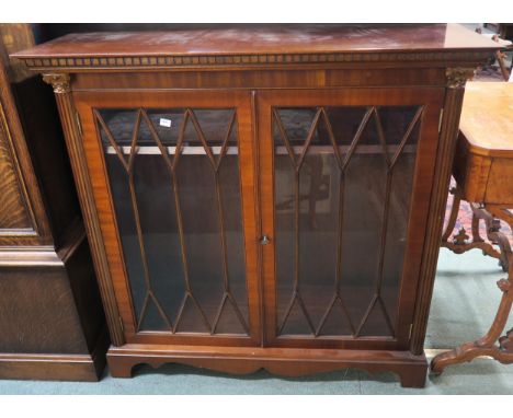 A 20th century matched pair of mahogany astragal glazed two door bookcases, 97cm high x 103cm wide x 37cm deep Condition repo