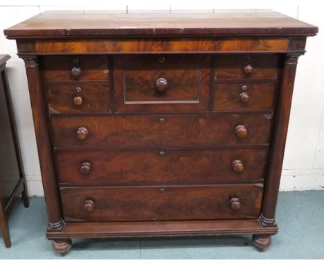 A Victorian mahogany scotch chest with four above three drawers flanked by columns on turned feet, 126cm high x 129cm wide x 