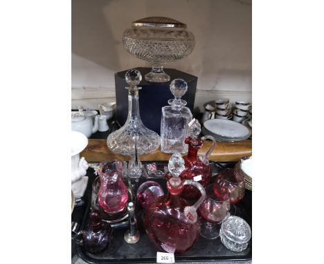 A quantity of cut glass and crystal including a pair of cranberry glass pitchers, a Caithness smoky glass bowl with frosted f