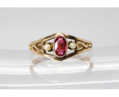 A 9ct gold red gem and full pearl set vintage ring, finger size P1/2, weight 2.2gms Condition report: Available upon request