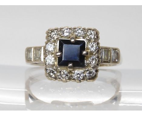 An 18ct white&nbsp; gold blue gem and diamond square shaped cluster ring, finger size P1/2, weight 4.8gms Light general wear