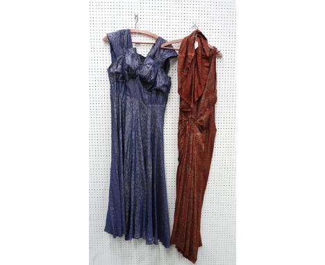 A lot comprising two gilt embroidered ladies evening gowns, the red example with a stole &amp; a light pink floral wedding ve