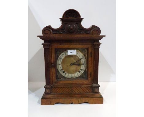 A walnut bracket clock with silvered chapter ring and gilt cherubs to each corner, marked MB 39868 Condition report: Availabl