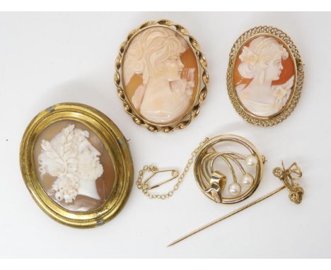 Two 9ct gold mounted cameo brooches, a 9ct pearl brooch and a 9ct vintage car lapel pin, weight combined 21.3gms, and a furth