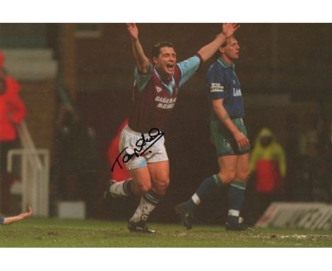 Tony Cottee signed colour 16 x 12 inch West Ham football photo. As a player he was a striker from 1982 until 2001, notably pl