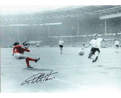 Geoff Hurst signed colour 16 x 12 inch 1966 World Cup final goal scoring football photo. He remains the only man to score a h