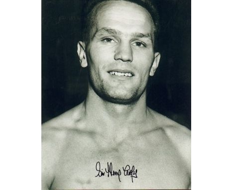 Sir Henry Cooper signed 16 x 12 black and white boxing portrait photo. English heavyweight boxer known for the sheer power of