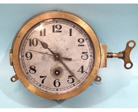 A WWII German Kriegsmarine brass bulkhead clock, the silvered dial with Arabic numerals, Slow/Fast (V/N) lever by '2' marked 