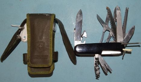 A Victorinox Swiss Army knife with nineteen various tools, in case, with compass, string, etc, (knife personalised with owner