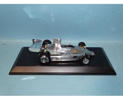 Exoto Grand Prix Classics, 1/18 scale model Ferarri 312T - polished metal, (in plastic display case, no box). 