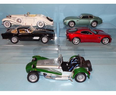 Four unboxed 1/18 scale diecast sports cars by Road Signature, Maisto, Burago and Mattel and an unnamed Super 7 Ford Cosworth