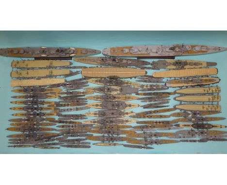 A representation of the WWII Japanese Fleet,&nbsp;89 1/700 scale water-line plastic kit models, with flattened lids of origin