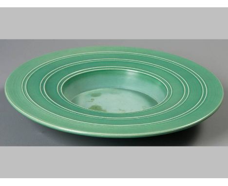 AN ART DECO MATT GREEN GLAZED WEDGEWOOD BOWL, CIRCA 1930's DESIGNED BY KEITH MURRAY, base signed and inscribed, 35.5cm diamet