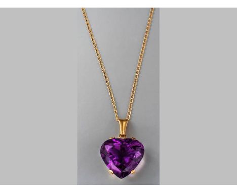 A 9CT YELLOW GOLD AND AMETHYST PENDANT, heart-shaped amethyst claw set in yellow gold frame with floral and leaf cut-out deco