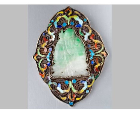 A CHINESE SILVER-GILT, CLOISONNÉ AND JADE BROOCH, of shield form, the filigree frame inset with cloisonné scroll work, centre