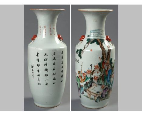 A CHINESE FAMILLE ROSE BALUSTER VASE, decorated with sages playing "Go", and studying a scroll beneath a pine tree, the rever