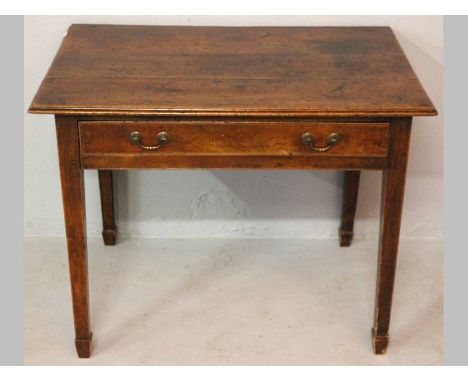 A GEORGE III YEW RECTANGULAR TABLE, the moulded top above a single drawer standing on square tapering legs, on bracket feet, 