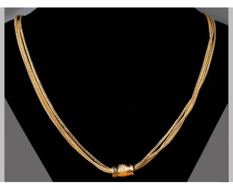 AN 18CT YELLOW GOLD CHAIN, triple strand with barrel form spacer, barrel decorated with enamel and scroll work, complete with