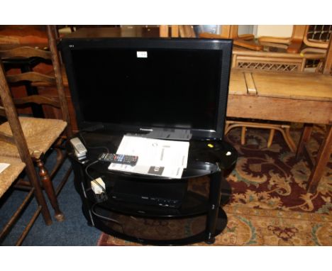 A PANASONIC 26" TV ON STAND WITH BLUE-RAY PLAYER H/C - REMOTE AND MANUAL
