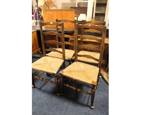 A SET OF FOUR OAK WICKER SEAT CHAIRS