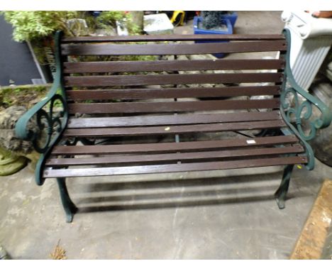 A GARDEN BENCH WITH CAST ENDS A/F