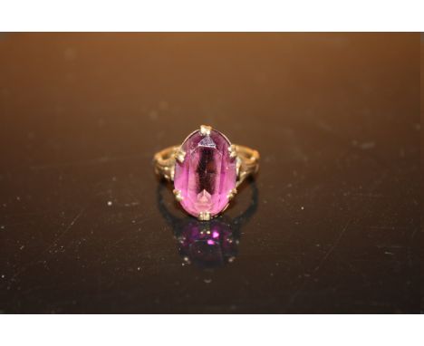 A 9CT GOLD RING SET WITH A LARGE AMETHYST SIZE L APPROX WEIGHT -3.5G