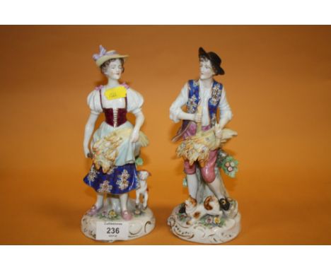 A PAIR OF CONTINENTAL STYLE CERAMIC FIGURES