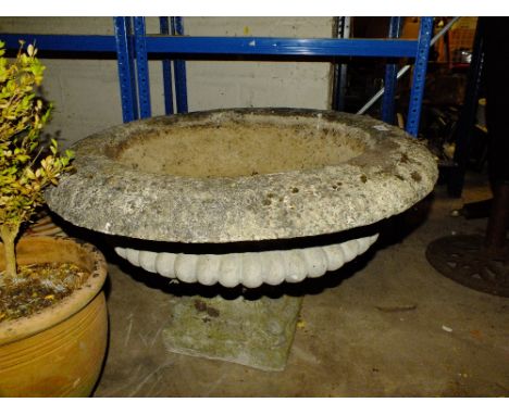 A LARGE CIRCULAR GARDEN PLANTER