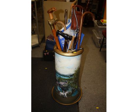 A LARGE HAND PAINTED AND PRINTED&nbsp; STONEWARE STICK STAND AND CONTENTS TO INCLUDE A SHOOTING STICK - HEIGHT OF STICK STAND