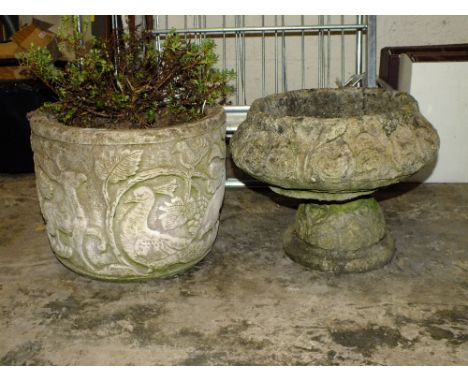 A FLORAL DESIGN PLANTER ON BASE TOGETHER WITH A LARGE STONE PLANTER WITH ANIMAL DETAIL