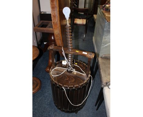 AN UNUSUAL BARREL/PRESS LAMP STAND