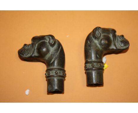 A PAIR OF MODERN BRONZE EFFECT DOGS HEAD SHAPED WALKING CANE POMMELS 