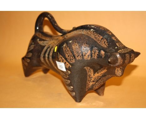 AN UNUSUAL RETRO CERAMIC FIGURE OF A BULL IN THE STYLE OF COLIN MELBOURNE 