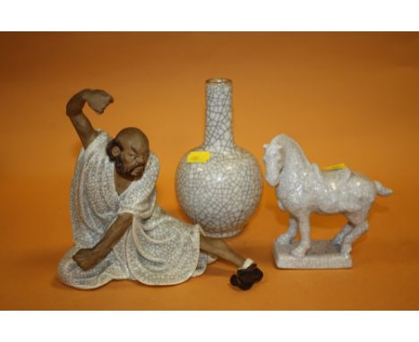 THREE ORIENTAL CERAMIC CRACKLE GLAZE ORNAMENTS TO INCLUDE A BOTTLE VASE AND A MALE FIGURE 