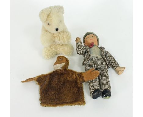 A Lupino Lane rag toy, 30cm high, a musical polar bear toy 'Brumas', 30cm high, and a glove puppet of a monkey