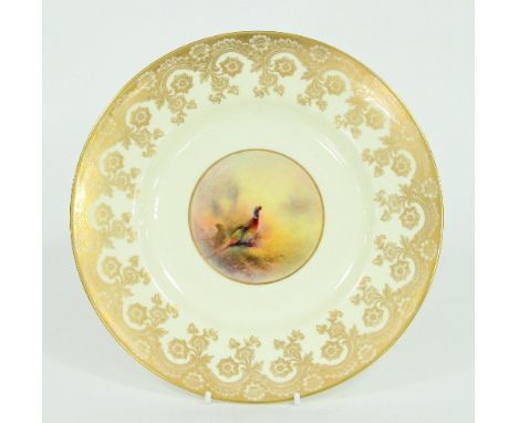 A Royal Worcester plate decorated by James Stinton, circa 1932, the central circular vignette depicting a cock and hen pheasa