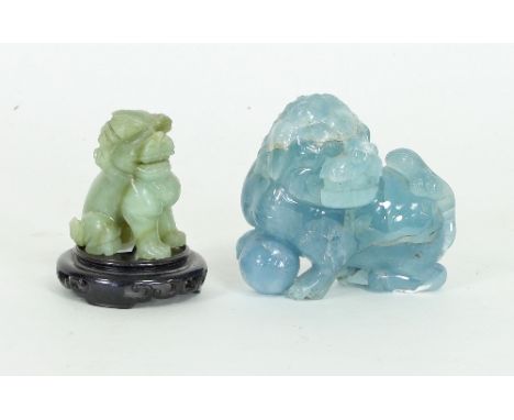A carved jade lion dog, 5.5cm high and a blue quartz lion dog, 9cm long