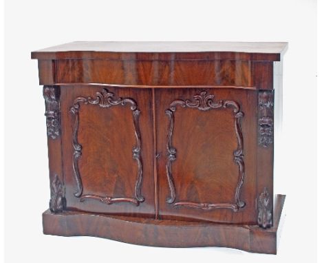 A Victorian mahogany serpentine fronted side cabinet, fitted a frieze drawer above twin panel doors on a plinth base, 115cm w