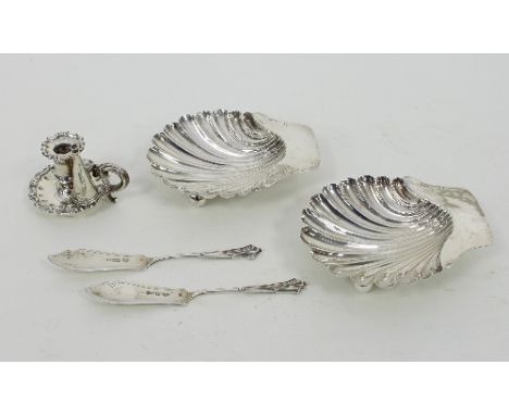 A pair of silver butter shells, London 1891, two butter knives and a taper stick and snuffer from an inkstand