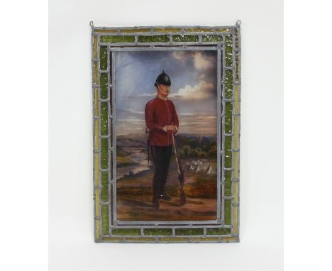 A 19th Century stained glass panel depicting a rifleman in uniform, with camp and landscape beyond, 55cm x 38cm 