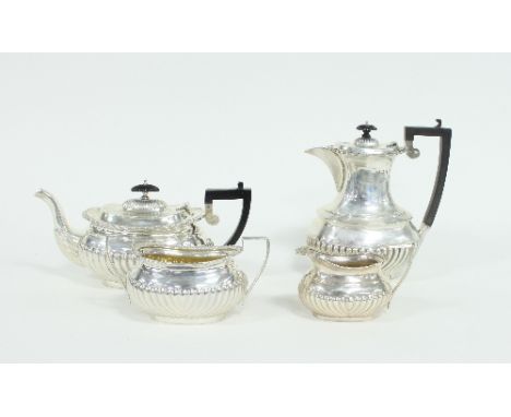 A silver four-piece tea and coffee service, J&C, Birmingham 1904/1905, of oval half ribbed form, coffee pot 22cm high Conditi