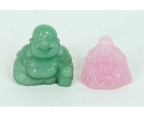 A Chinese carved jade buddhistic figure, 4cm high and another in rose quartz, 4cm high