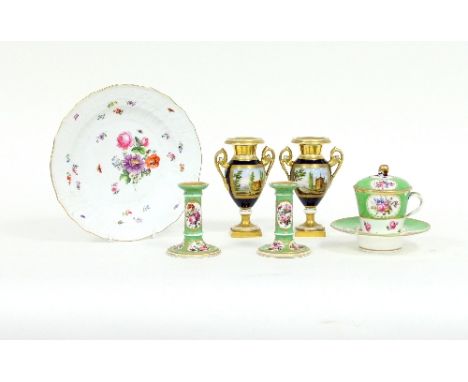 A late 18th Century Sèvres trembleuse porcelain, cup, cover and stand and a similar pair of small candlesticks, painted with 