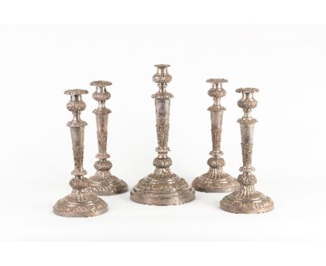 A set of five plated candlesticks, each with thistle shaped sconce, stiff leaf decoration to the tapering stem and on a circu
