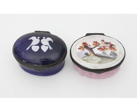A Bilston enamel patch box, late 18th Century, the oval cover depicting a bird in a tree and enclosing a mirror and a blue en
