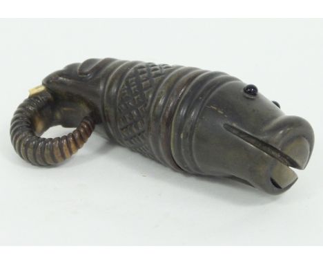 A 19th Century horn whistle topped snuff box, carved a hippopotamus to one end and an elephant to the other, 12cm long Condit