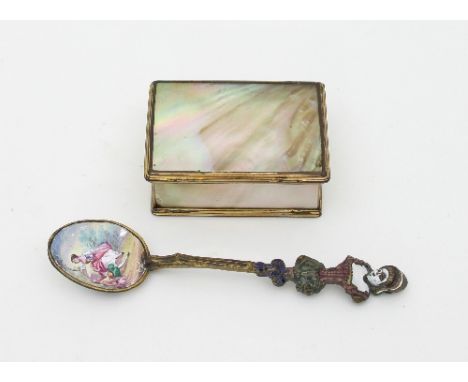 An early 19th Century mother-of-pearl trinket box, with gilt metal mounts, 6.5cm wide and an enamelled spoon with maidenhead 