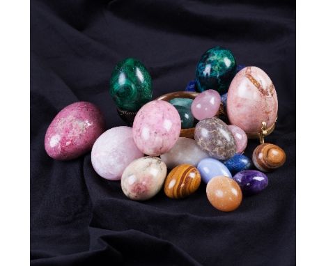 A collection of eighteen mineral eggs including rose quartz, lapis lazuli, malachite, tiger's eye, etc, a lapis stand, a marb